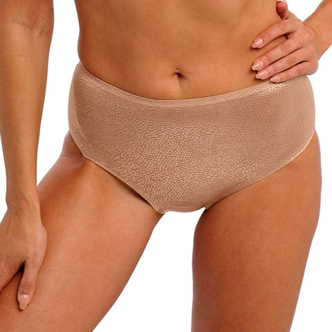 Beige underwear worn by a person on a white background