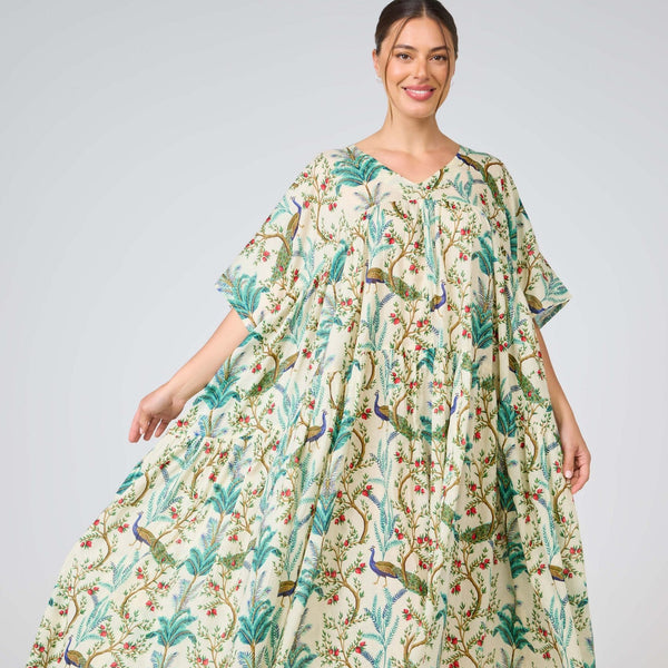 Woman wearing a floral dress with a plain background
