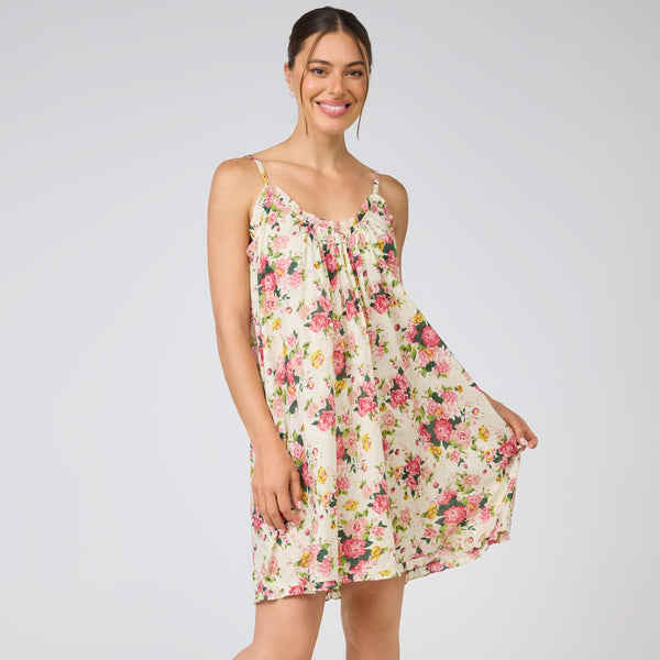 Woman wearing a floral dress on a white background