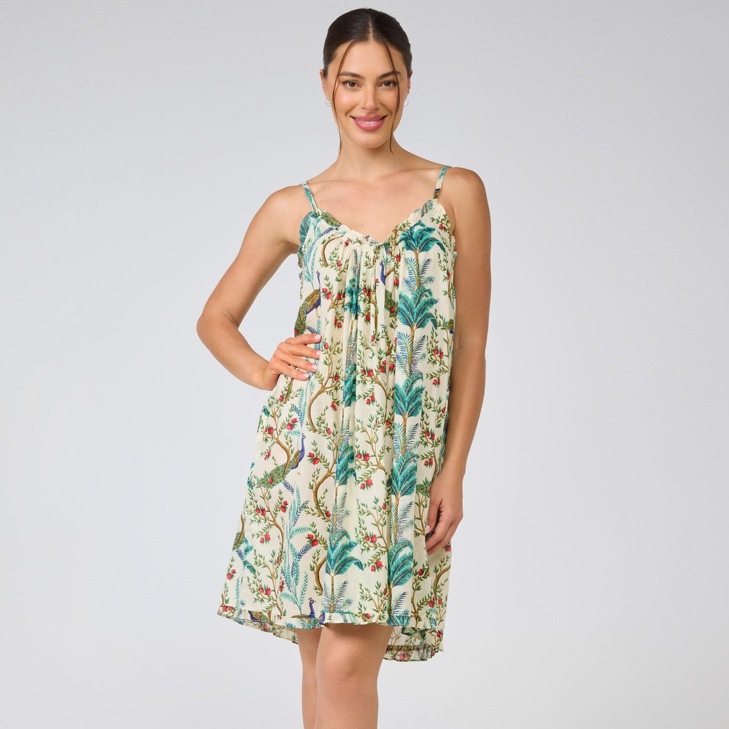 Woman wearing a floral dress on a white background