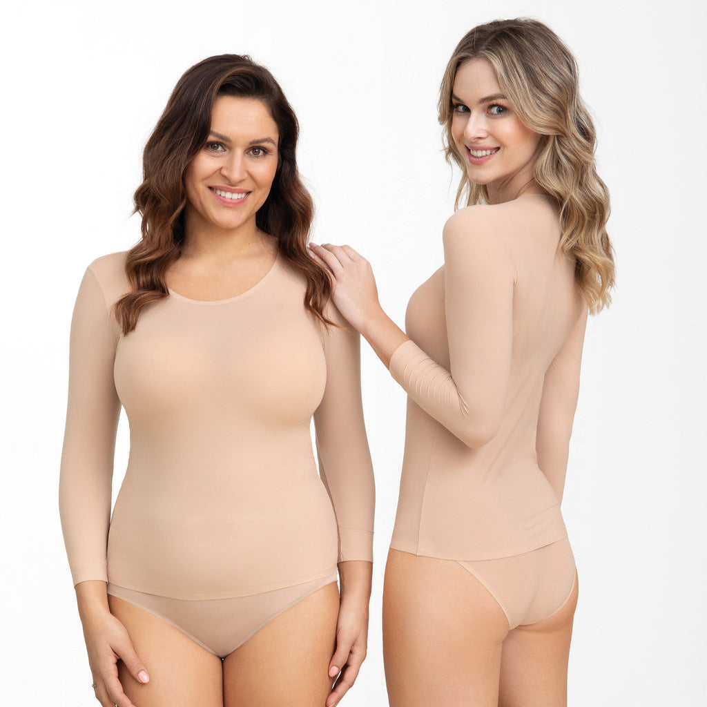 Two women wearing beige bodysuits on a white background
