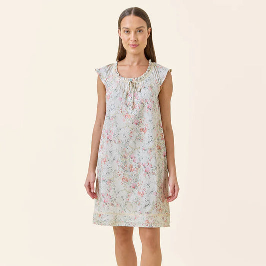 Woman wearing a floral nightgown on a beige background