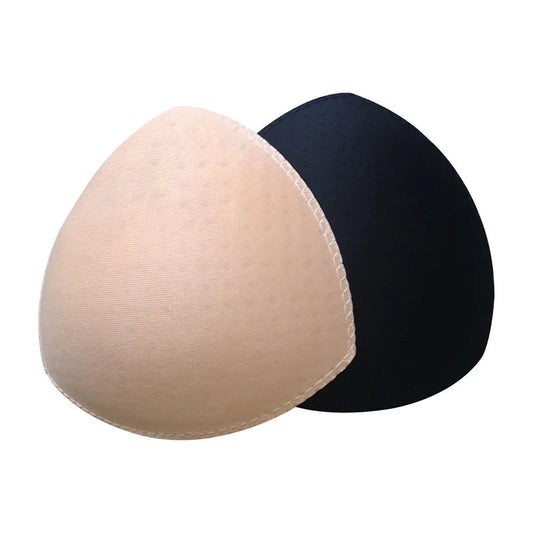Beige and black bra pads on a white background