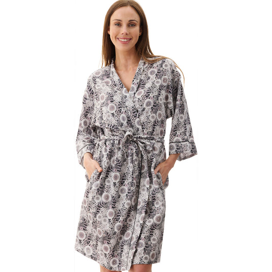 Woman wearing a patterned robe on a white background