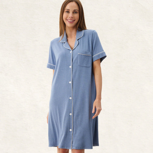 Woman wearing a blue nightshirt on a white background