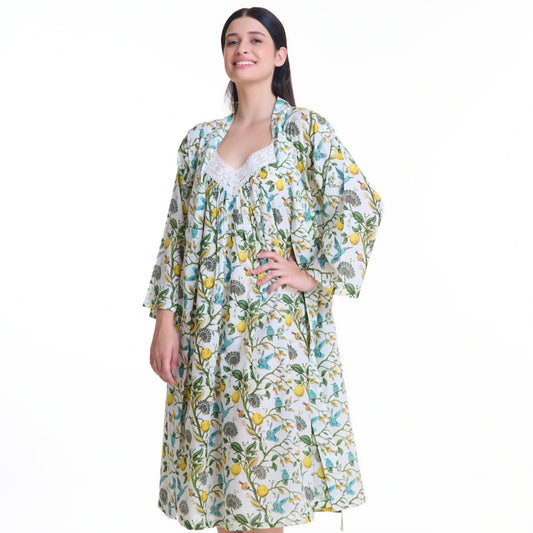 Woman wearing a floral nightgown and robe on a white background