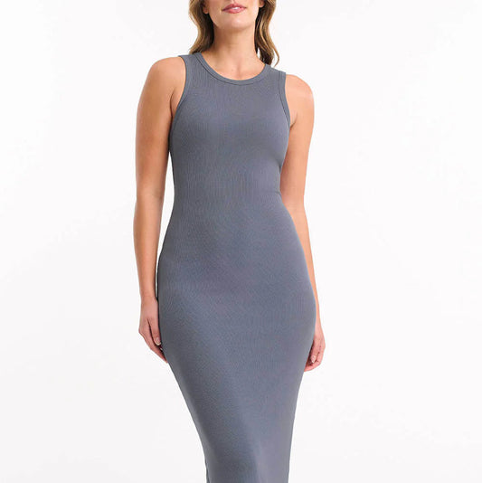 Woman wearing a gray sleeveless dress on a white background