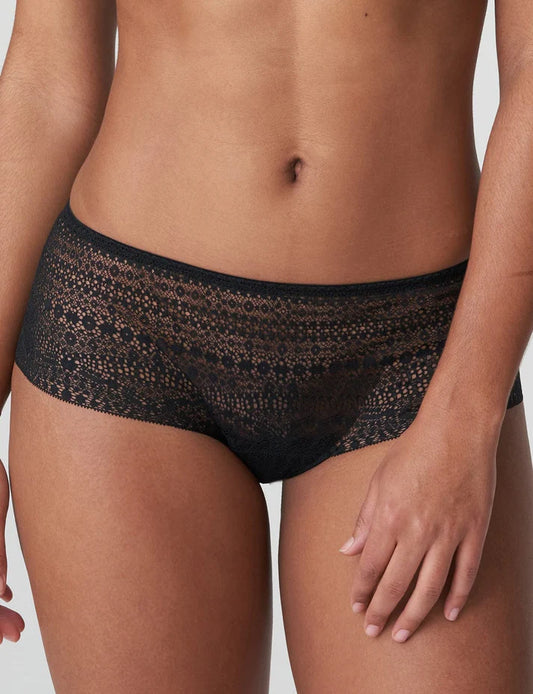 Black lace underwear worn by a person on a neutral background